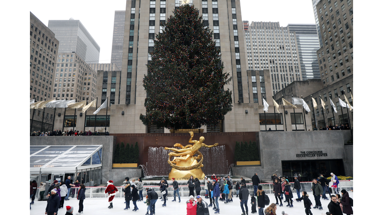 Santa Claus Skates At NYC's Rockefeller Center Ice Rink To Mark Holiday Season