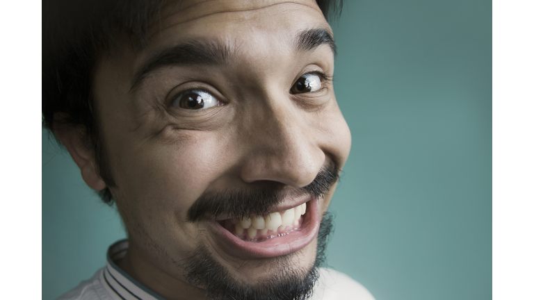 Close up of a happy young man.