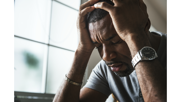 Black guy stressing and headache