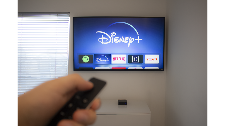 Person holds an Apple TV remote using the new Disney+ app on a Vizio TV. Disney+ video streaming service will exclusively show Star Wars: Jedi Template Challenge.