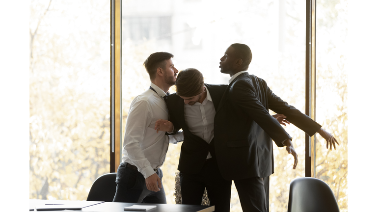 Male colleagues fight having conflict in office