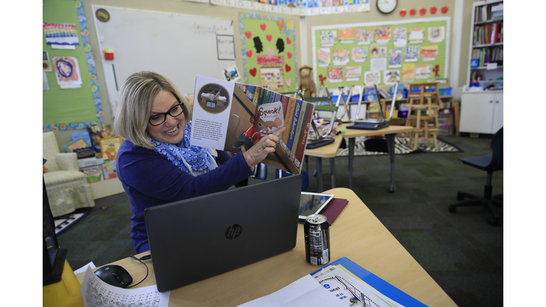 Teacher Instructs Remotely From Empty Classroom