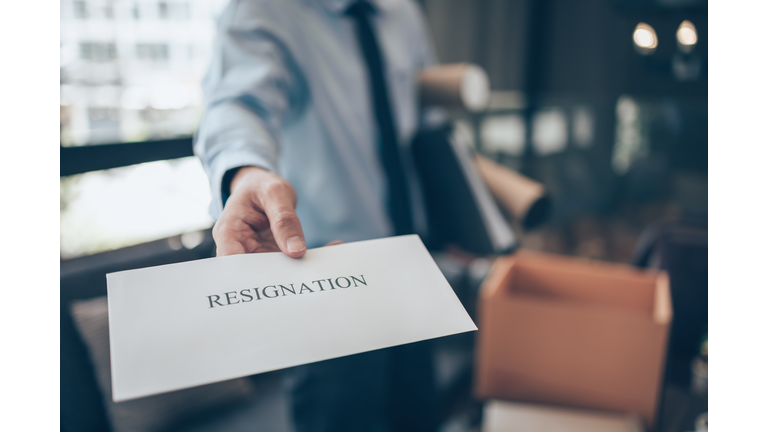 Businessman sending and showing resignation letter to employer boss. Quiting a job, businessman fired or leave a job concpet.