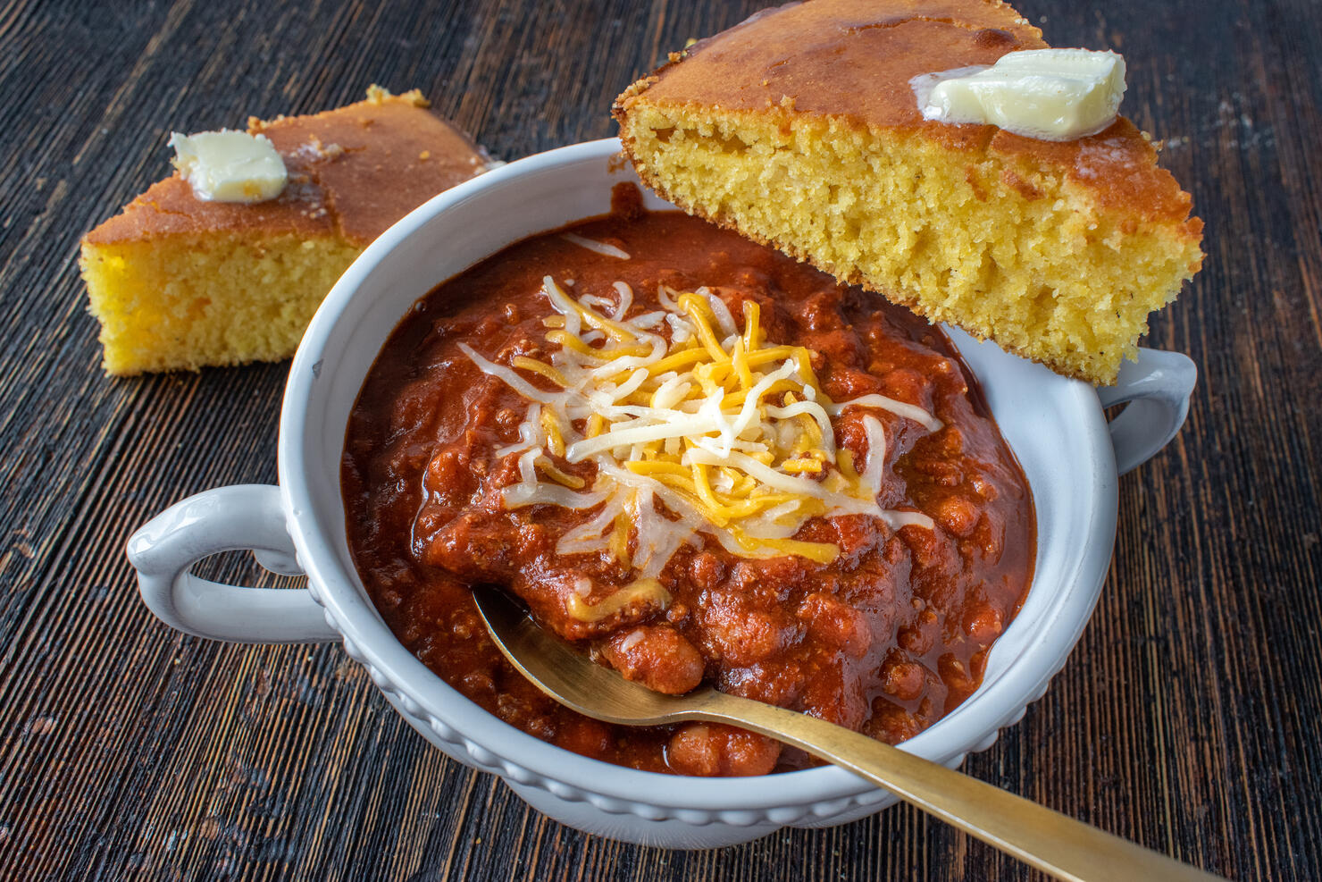 closeup of bowl of homemade chili with cornbread