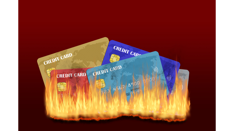 Burning Credit Cards With Fire and Smoke Isolated on Red Background