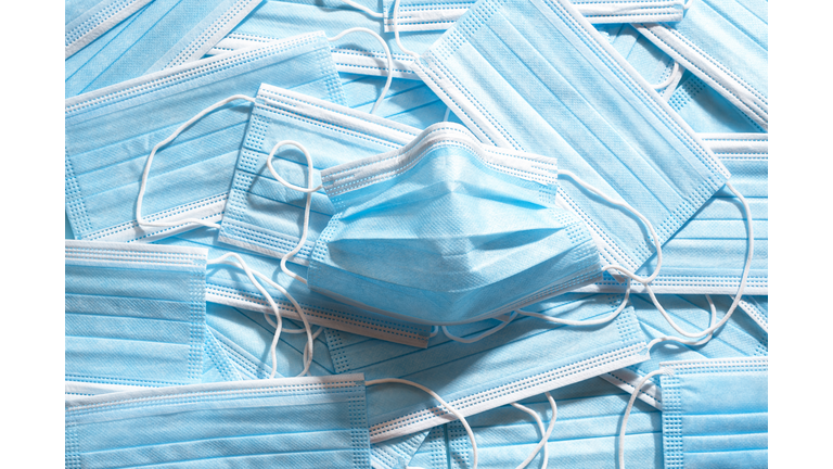Medical masks top view. Pile of blue protective masks