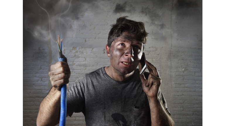 electrocuted man calling for help in dirty burnt funny face