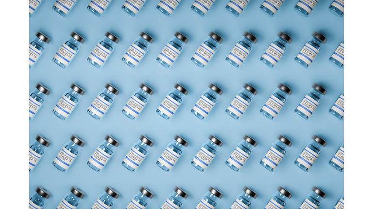 pattern of vaccine bottles against covid-19 with injection fluid. 3D ilustration