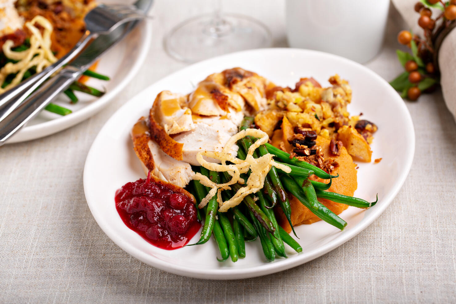 Traditional Thanksgiving plates with turkey and sides