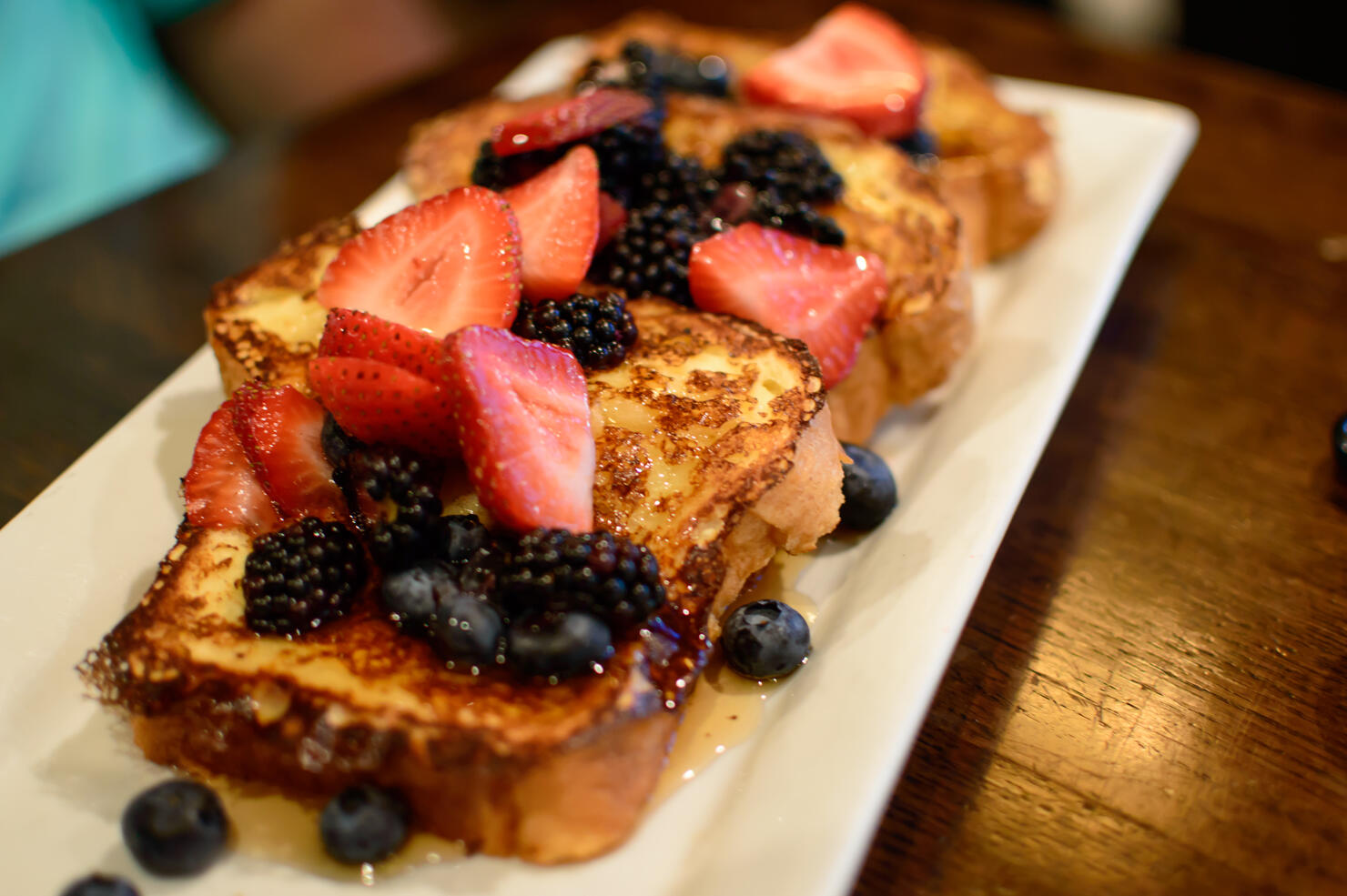 French toast with sliced berries strawberry, blackberry and blueberry