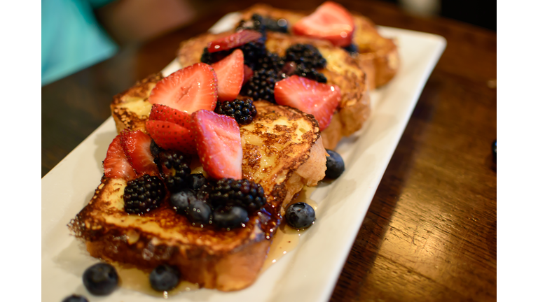 French toast with sliced berries strawberry, blackberry and blueberry