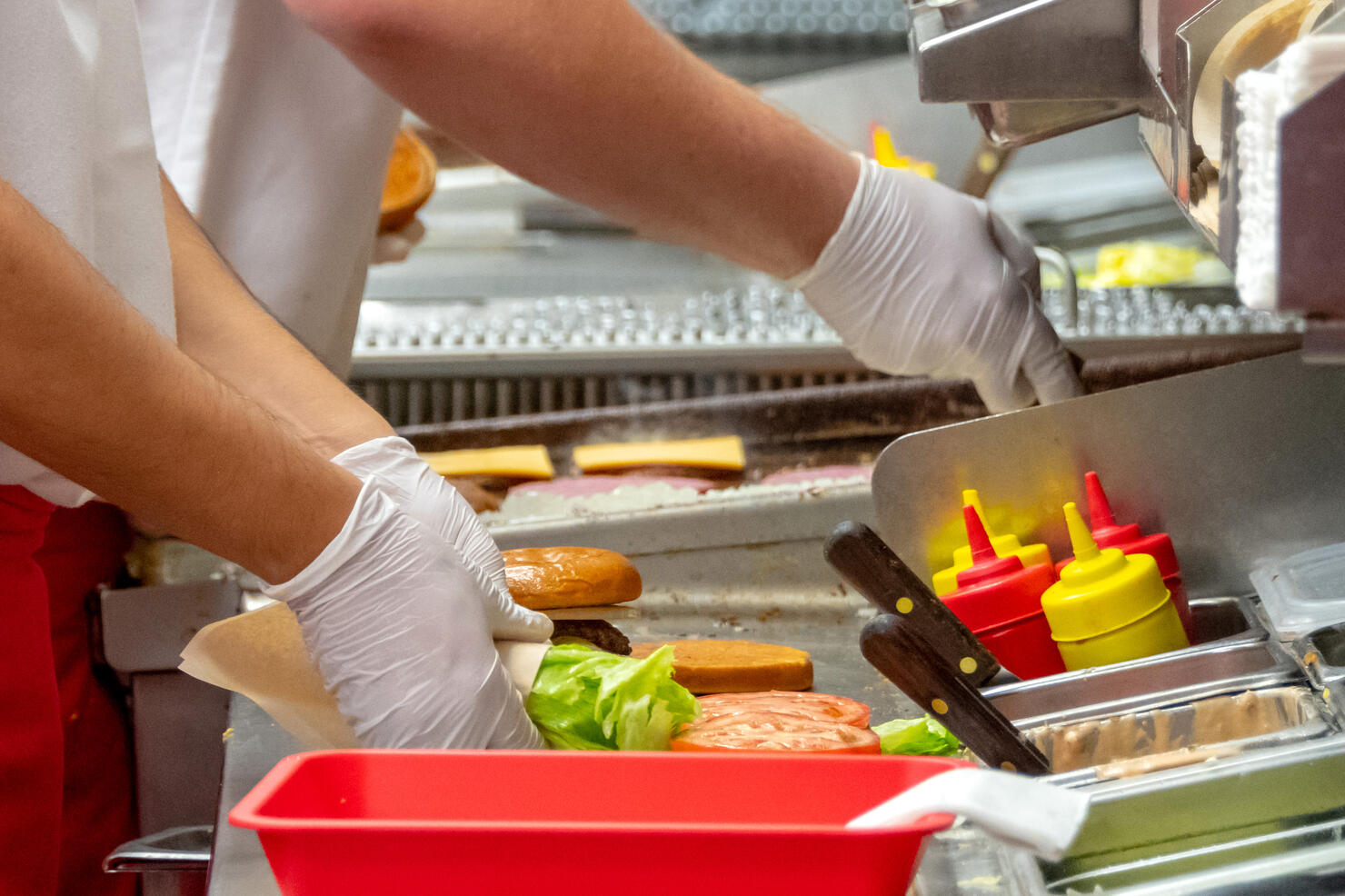 Fast food workers working in a hamburger restaurant