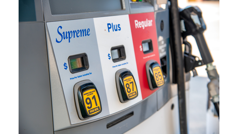 Supreme, Plus, Regular gasoline at gas station pump.