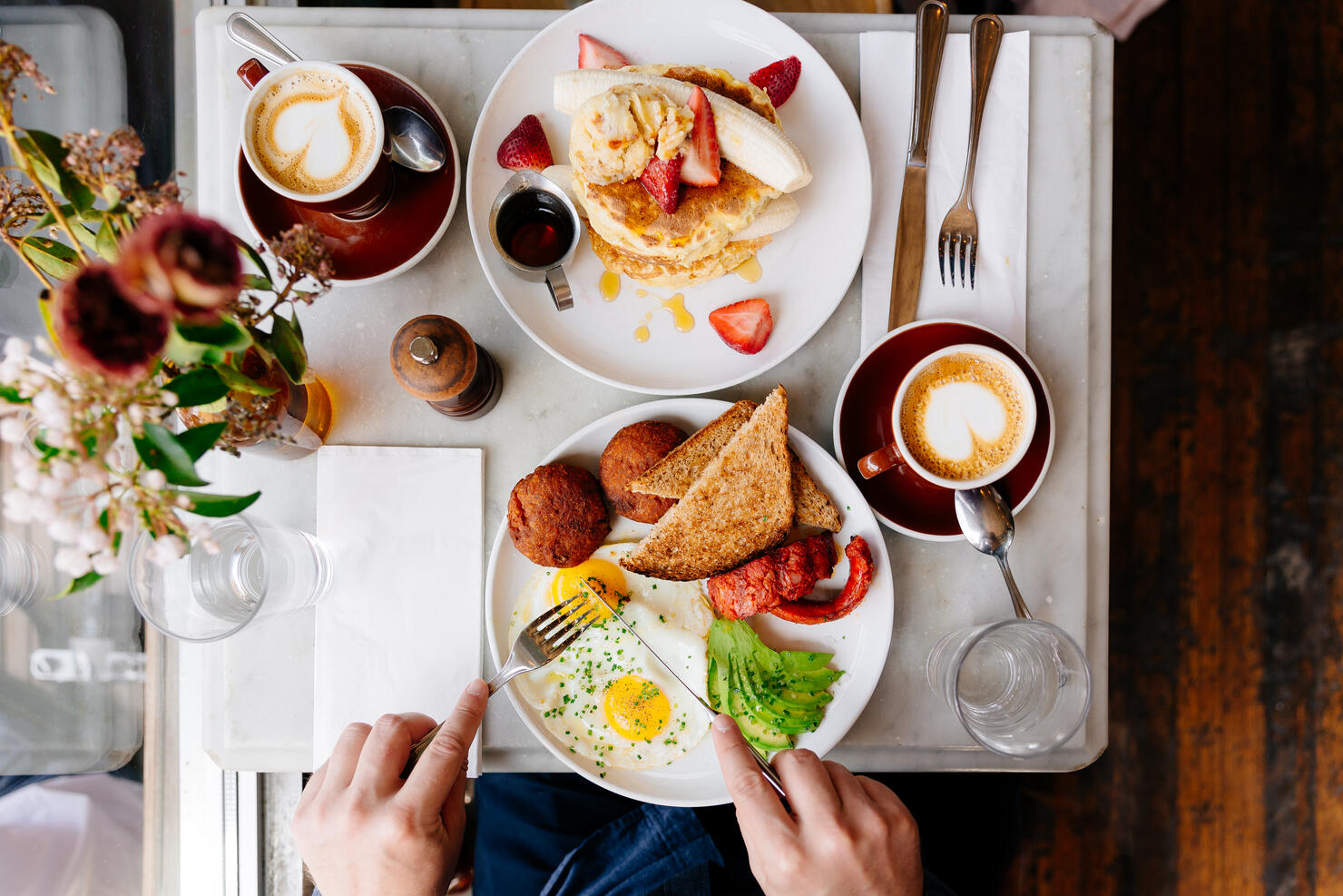 Man eating brunch at the restaurant, directly above view