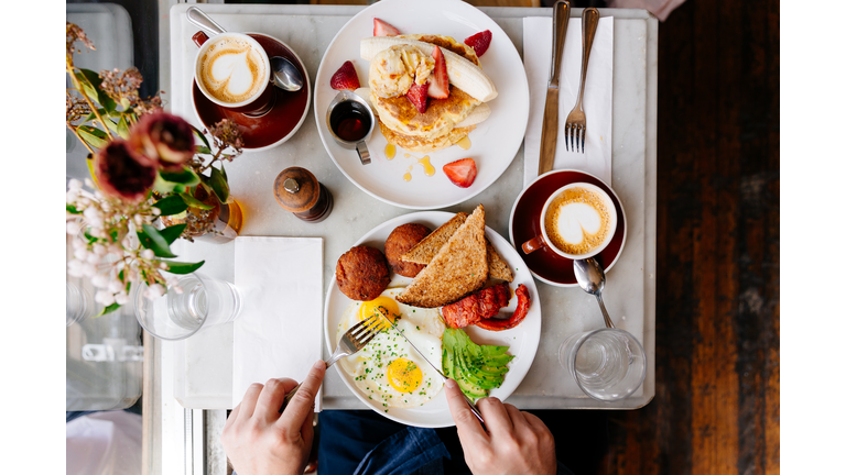 Man eating brunch at the restaurant, directly above view