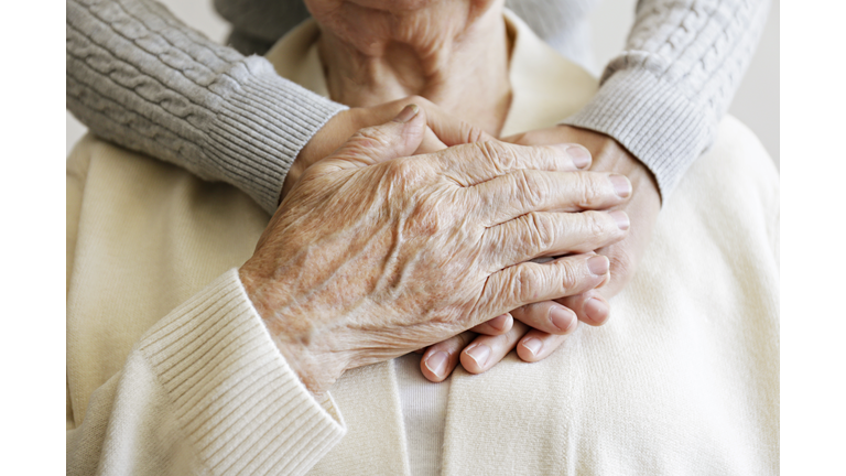 Cropped shot of elderly female's hands.