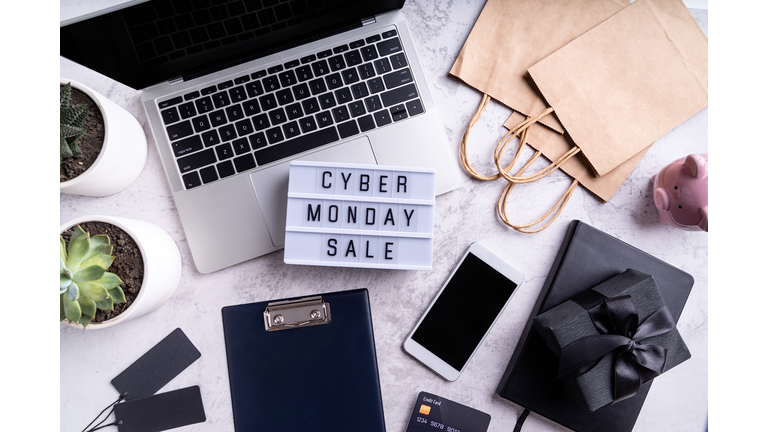 cyber monday sale text on lightbox, top view of workspace flat lay