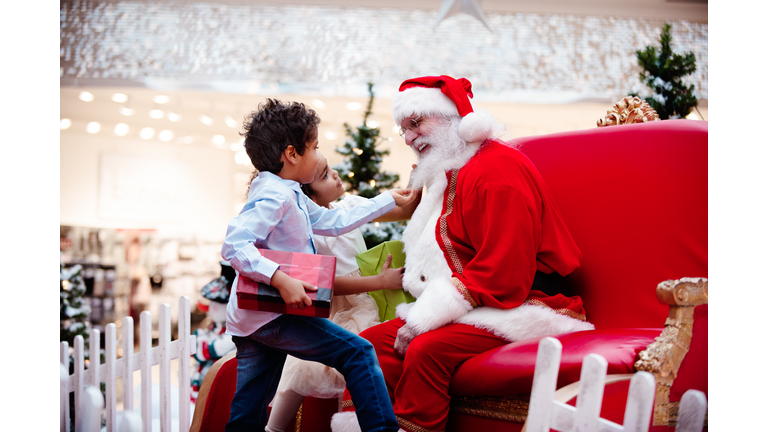 Shopping Christmas with family and Santa Claus at Shopping Mall