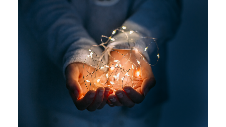 christmas light on hands