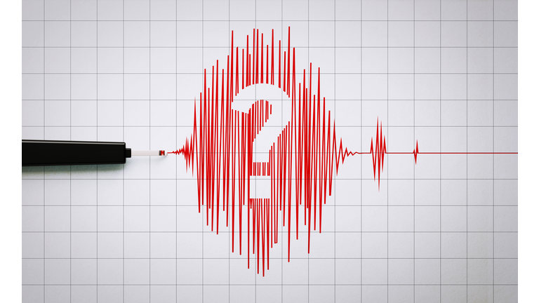 Seismograph Recording an Earthquake Activity on Grid Paper