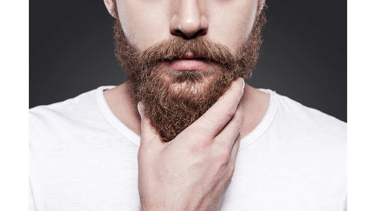 Touching his perfect beard.