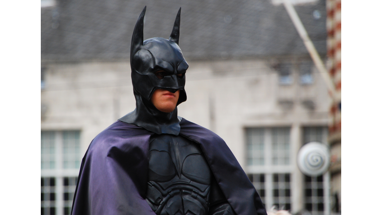 Actor in Batman costume in pose in central Dam square