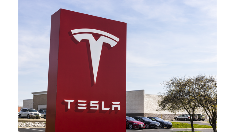 Tesla Service Center. Tesla designs and manufactures the Model S electric sedan IV