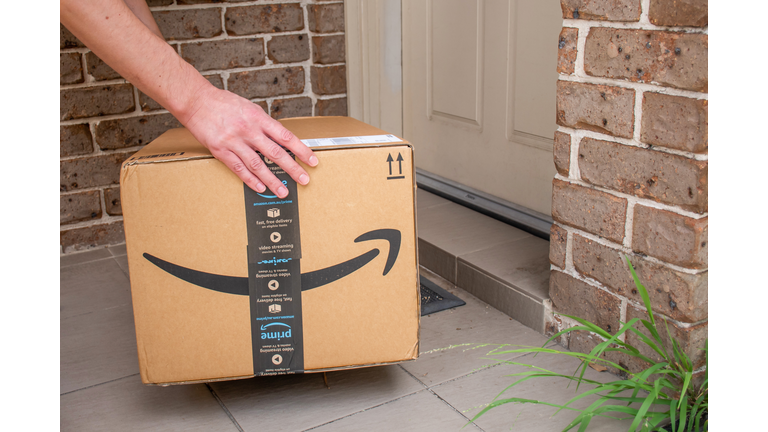 Amazon prime boxdelivered to a front door of residential building