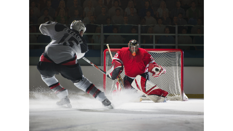 Ice hockey goalkeeper blocking a shot