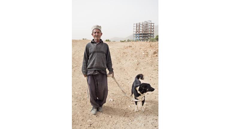 Qahqai man and his dog.