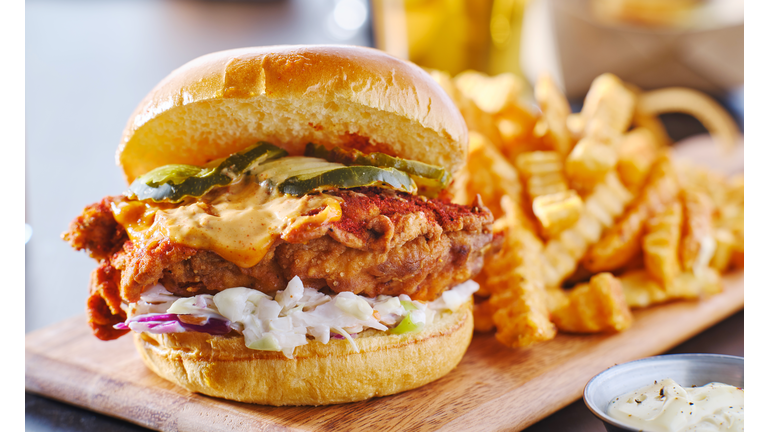 spicy nashville hot chicken sandwich with coleslaw and pickles
