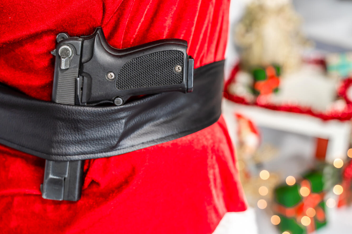 Semi-automatic pistol in Santa Claus belt