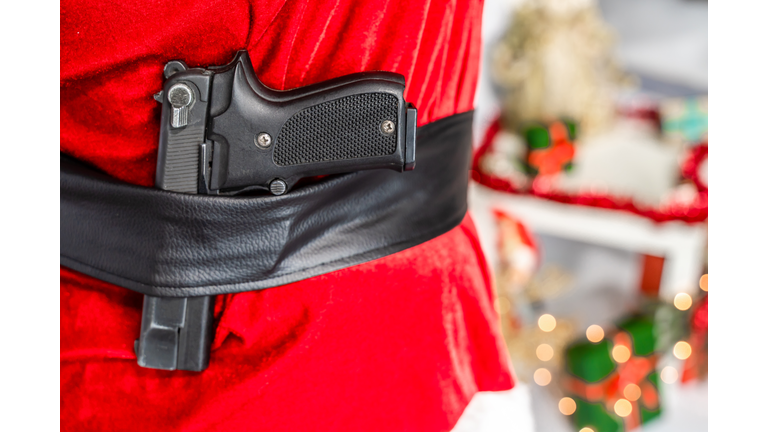 Semi-automatic pistol in Santa Claus belt