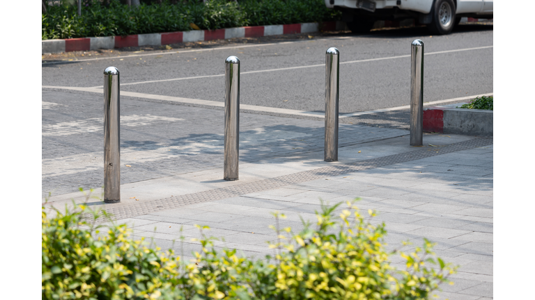 stainless steel bollards at concrete pavement.