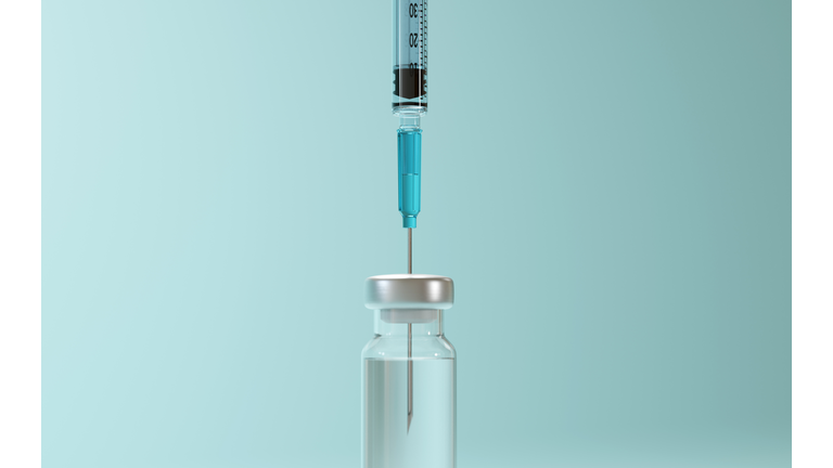Closeup of vaccine flask and syringe. Shallow depth of field. 3D render.