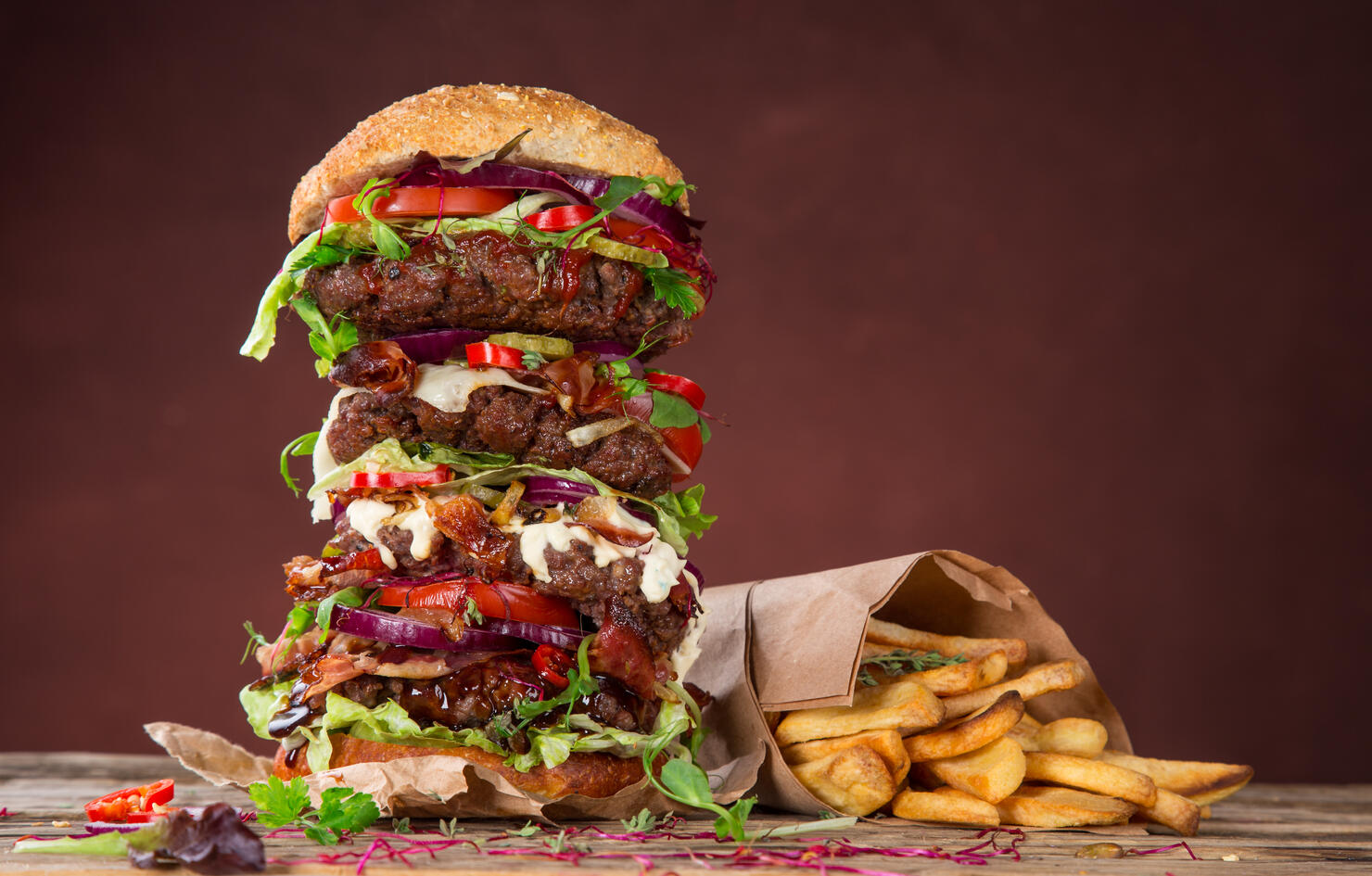 Tasty big burger on wooden table