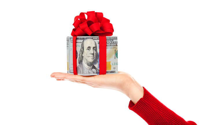 Cash Money Christmas Present of U.S. Currency on White Background