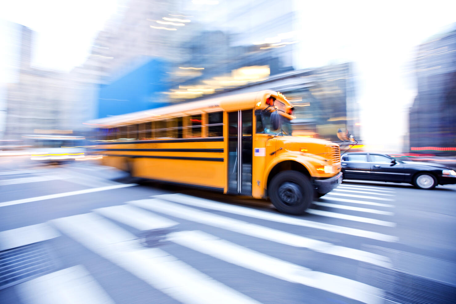 Motion Blur of School Bus in City