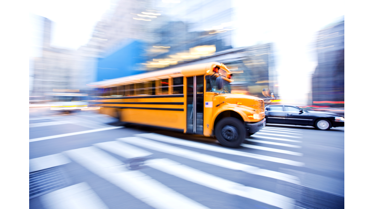 Motion Blur of School Bus in City