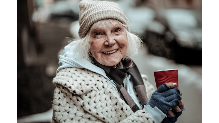 Portrait of a cheerful nice aged woman