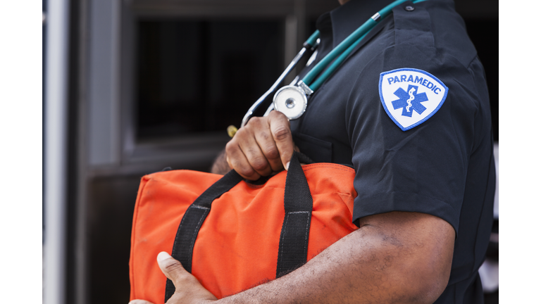 Paramedic holding medical bag