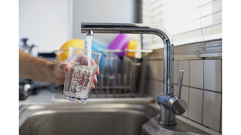 Man holding a glass of water