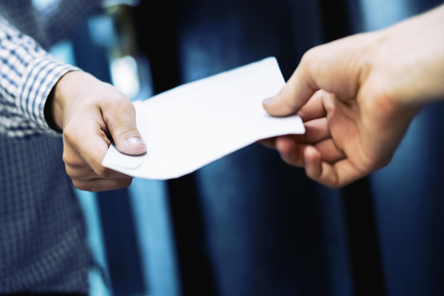 young postman brings letter envelope delivery to home