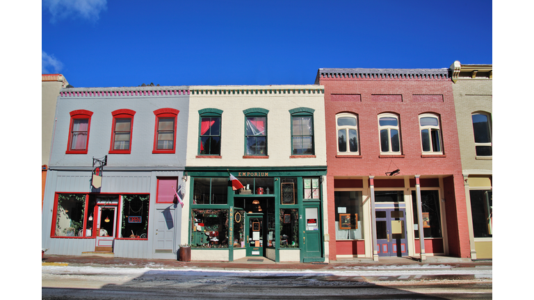 Storefronts along street, winter