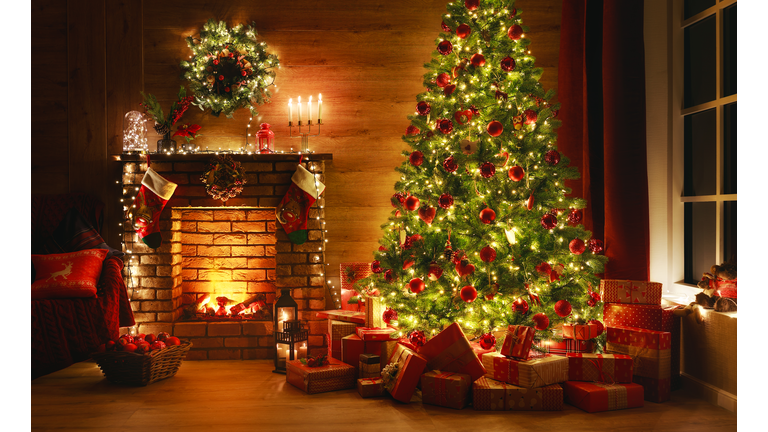 interior christmas. magic glowing tree, fireplace, gifts in  dark