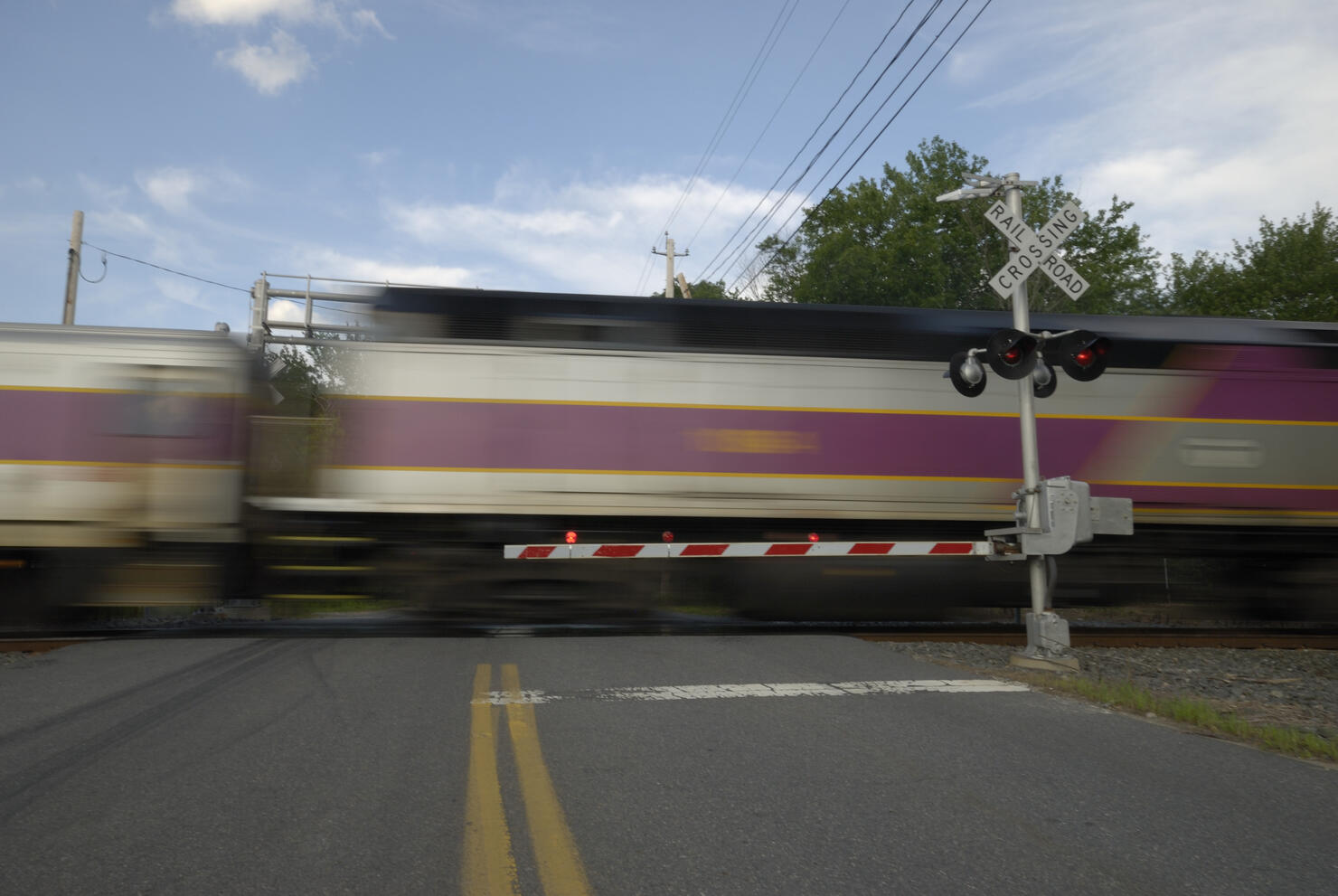 Speeding train crossing a street