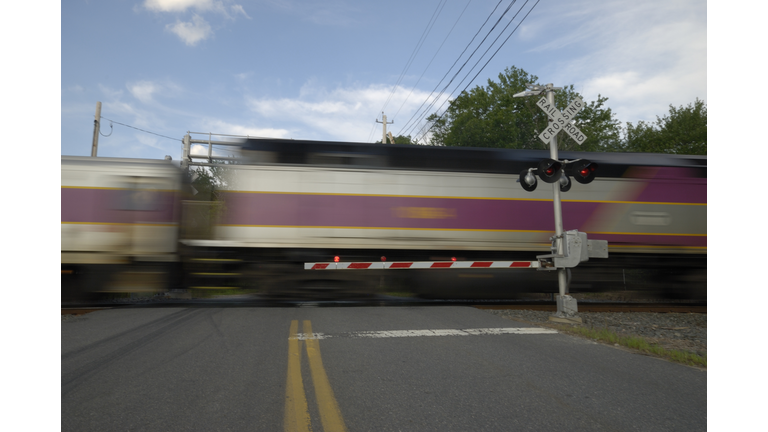 Speeding train crossing a street