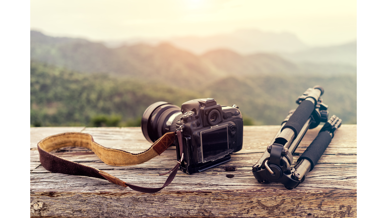 Travel photographer equipment with beautiful landscape