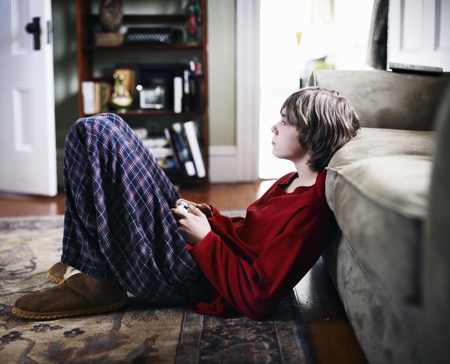 Teenage boy playing video games