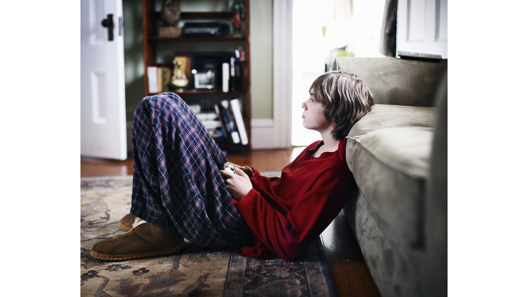 Teenage boy playing video games